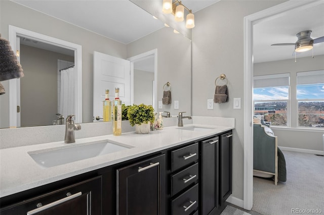 bathroom with ceiling fan and vanity