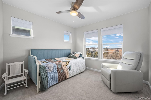 bedroom featuring ceiling fan and light carpet