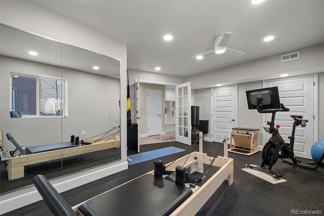 workout room featuring ceiling fan and french doors