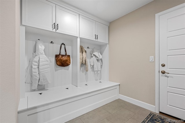 mudroom with light tile patterned flooring