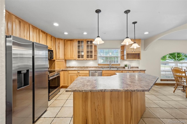 205 Beech St, Hudson, CO 80642 - kitchen with appliances with stainless steel finishes, light tile patterned flooring, plenty of natural light, and recessed lighting