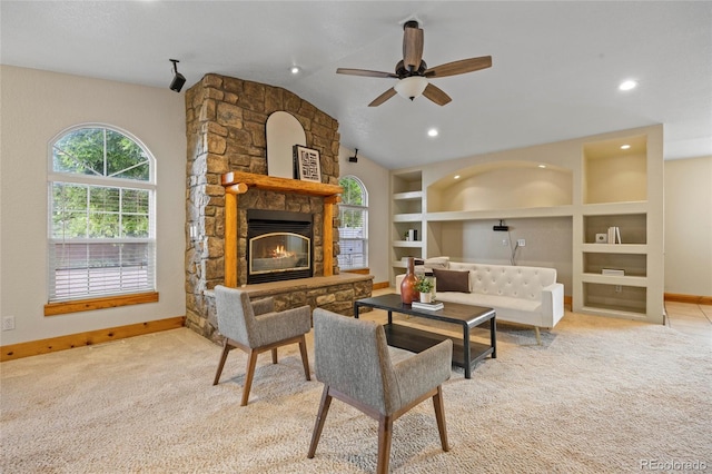 205 Beech St, Hudson, CO 80642 - carpeted living room with ceiling fan, a fireplace, lofted ceiling, built in shelves, and recessed lighting