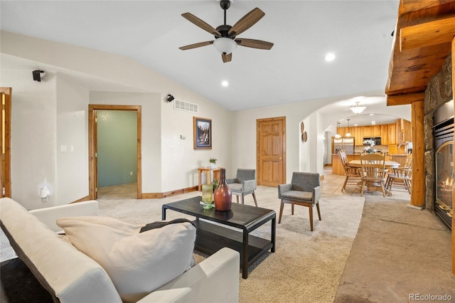205 Beech St, Hudson, CO 80642 - living area with arched walkways, light carpet, vaulted ceiling, recessed lighting, and ceiling fan