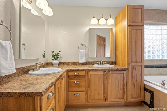 205 Beech St, Hudson, CO 80642 - bathroom with double vanity, tiled bath, and tile patterned floors