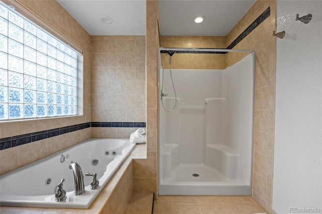 205 Beech St, Hudson, CO 80642 - full bath featuring a tub with jets, walk in shower, and tile patterned floors