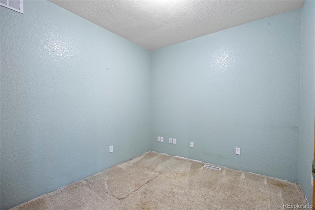 205 Beech St, Hudson, CO 80642 - carpeted empty room featuring a textured ceiling and a textured wall