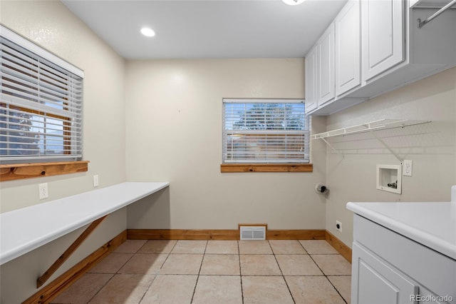 205 Beech St, Hudson, CO 80642 - washroom with cabinet space, washer hookup, plenty of natural light, light tile patterned floors, and recessed lighting