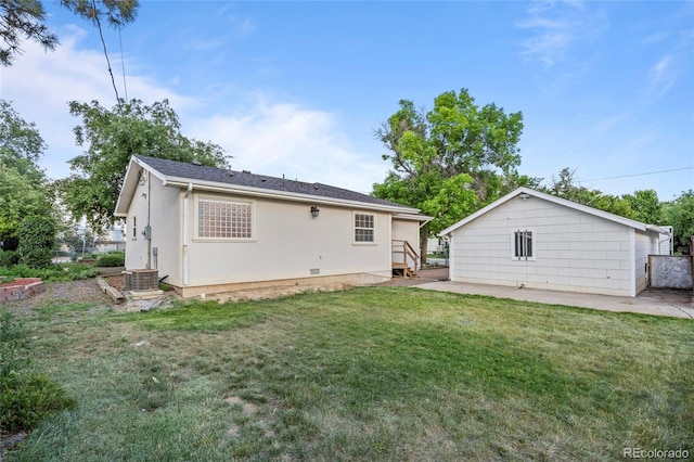 205 Beech St, Hudson, CO 80642 - rear view of house featuring a yard, stucco siding, and a patio area
