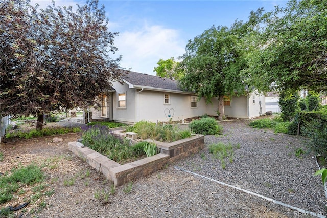 205 Beech St, Hudson, CO 80642 - view of front facade featuring stucco siding