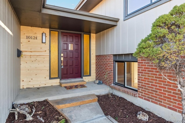 entrance to property with brick siding