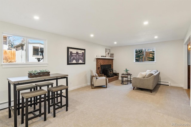 carpeted living room with baseboards, a baseboard heating unit, and recessed lighting