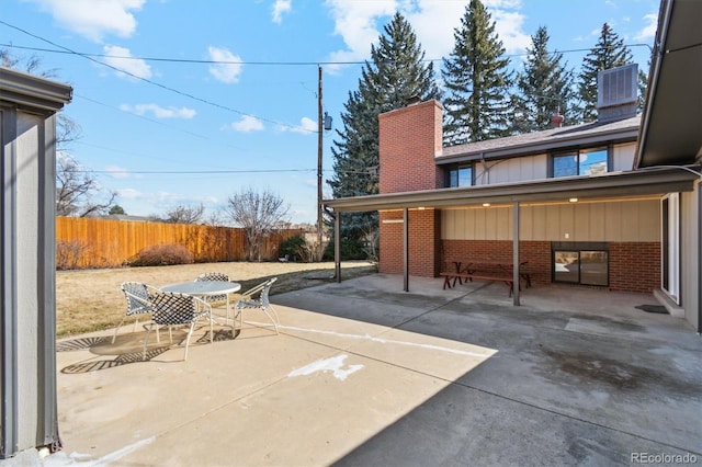 view of patio featuring fence