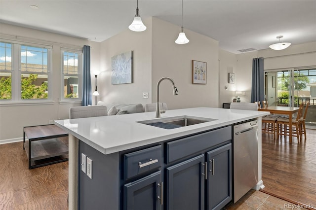 837 E 98th Ave Unit 405, Thornton, CO 80229 - kitchen featuring dishwasher, light countertops, open floor plan, and hanging light fixtures