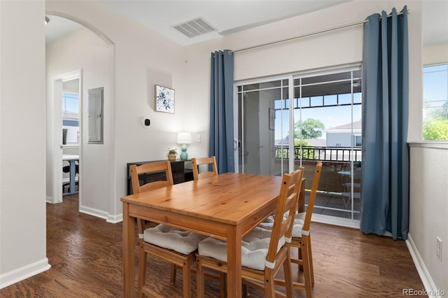 837 E 98th Ave Unit 405, Thornton, CO 80229 - dining space with arched walkways, dark wood-style flooring, and electric panel