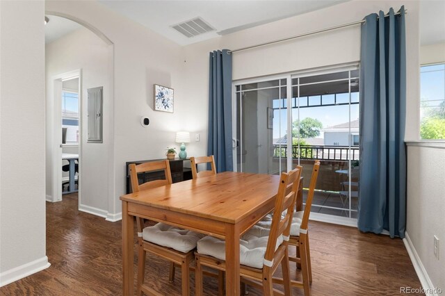 837 E 98th Ave Unit 405, Thornton, CO 80229 - dining space with arched walkways, dark wood-style flooring, and electric panel