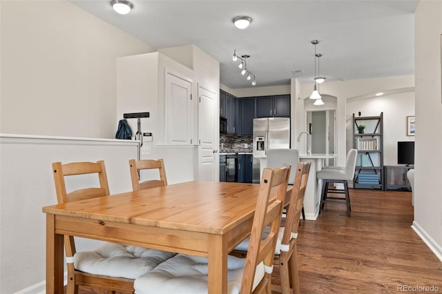 837 E 98th Ave Unit 405, Thornton, CO 80229 - dining space with dark wood finished floors and baseboards