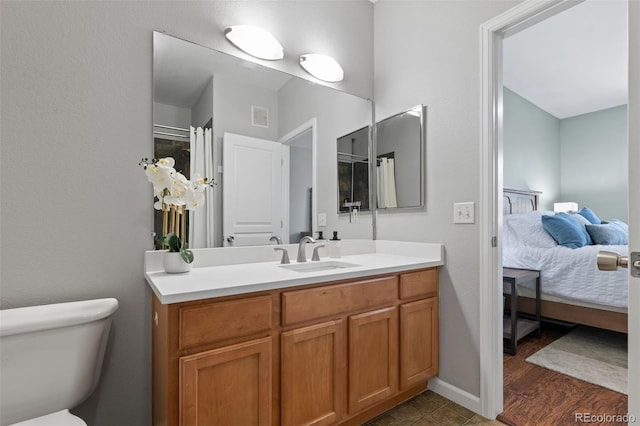 837 E 98th Ave Unit 405, Thornton, CO 80229 - ensuite bathroom featuring vanity and toilet
