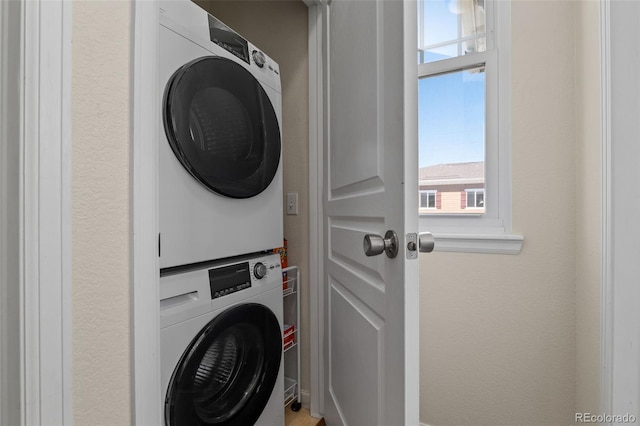 837 E 98th Ave Unit 405, Thornton, CO 80229 - laundry room with stacked washer / dryer and plenty of natural light