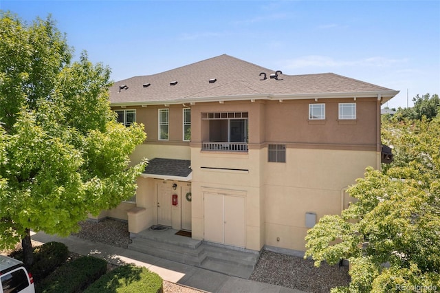 837 E 98th Ave Unit 405, Thornton, CO 80229 - back of house with stucco siding and roof with shingles