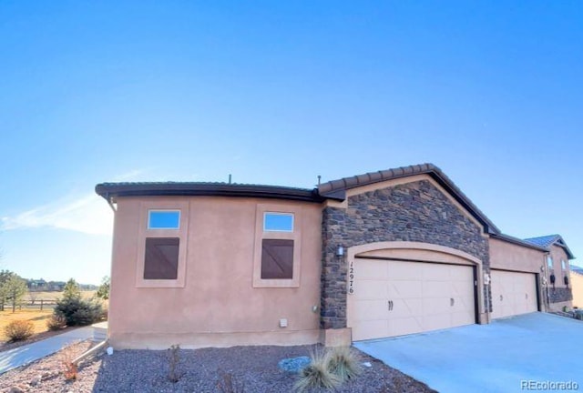 view of front of property featuring a garage