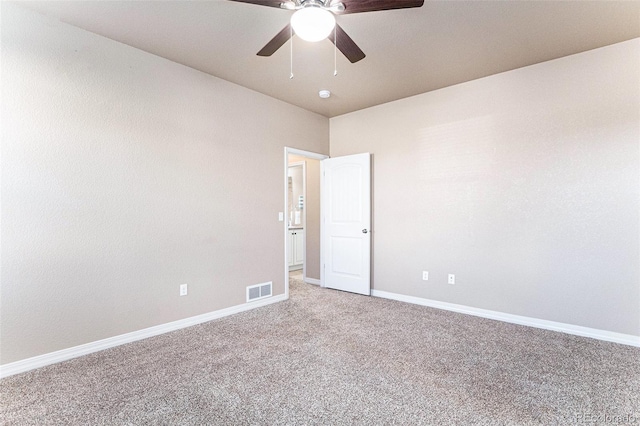 empty room featuring carpet flooring and ceiling fan