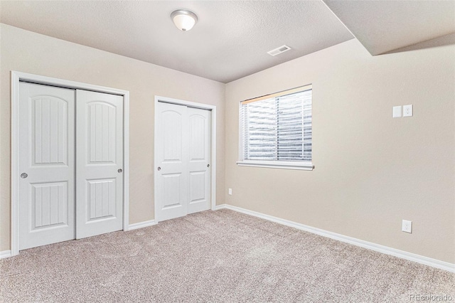 unfurnished bedroom with carpet floors