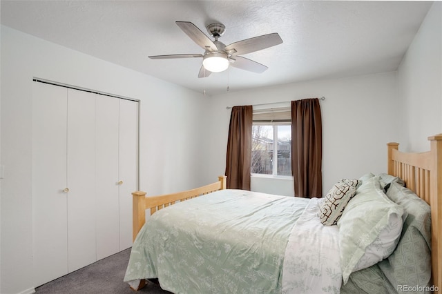 carpeted bedroom with a closet and ceiling fan