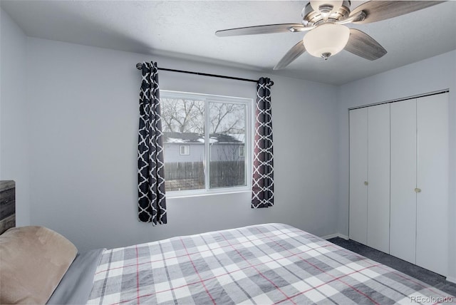 unfurnished bedroom with a closet, ceiling fan, and a textured ceiling