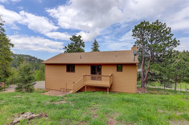 31150 Manitoba Dr, Evergreen, CO 80439 - back of house with a chimney, a wooden deck, and stairway