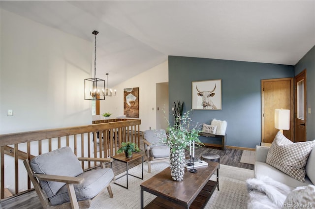 31150 Manitoba Dr, Evergreen, CO 80439 - living room with a chandelier, wood finished floors, and vaulted ceiling