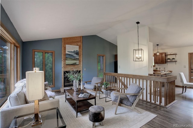 31150 Manitoba Dr, Evergreen, CO 80439 - living area featuring vaulted ceiling and wood finished floors