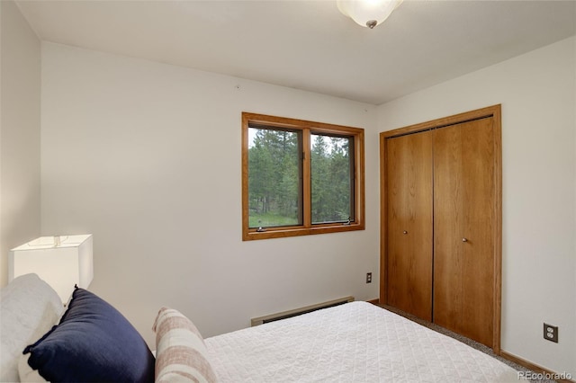 31150 Manitoba Dr, Evergreen, CO 80439 - bedroom featuring baseboard heating and a closet