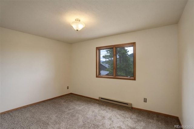31150 Manitoba Dr, Evergreen, CO 80439 - empty room with a baseboard heating unit and light colored carpet