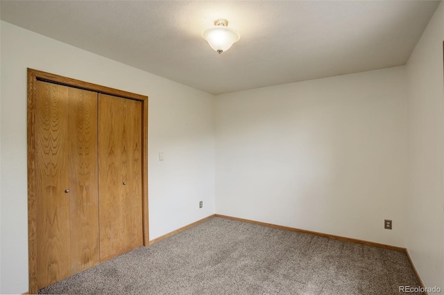 31150 Manitoba Dr, Evergreen, CO 80439 - unfurnished bedroom featuring carpet floors and a closet