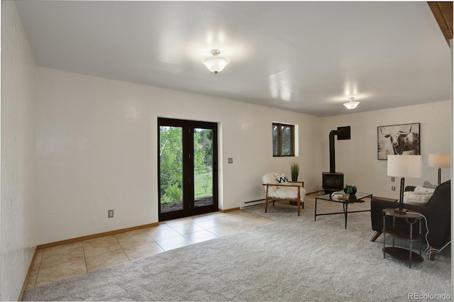31150 Manitoba Dr, Evergreen, CO 80439 - carpeted living area with tile patterned flooring, a wood stove, and baseboard heating