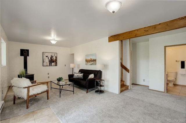 31150 Manitoba Dr, Evergreen, CO 80439 - living area with a wood stove, stairway, tile patterned flooring, and carpet flooring