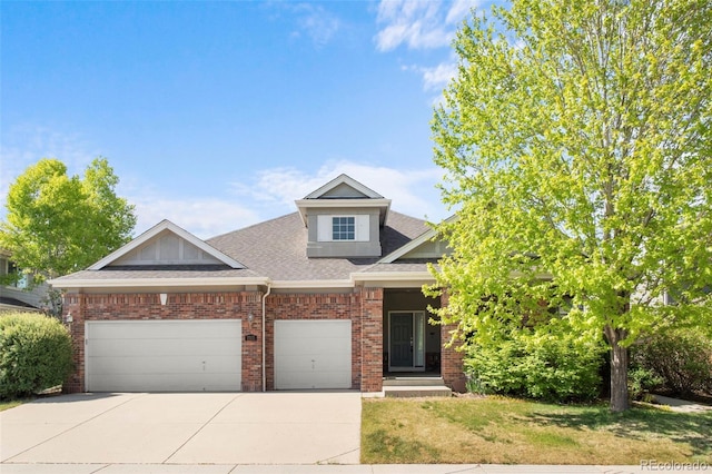 1513 Cannon Mountain Dr, Longmont, CO 80503 - view of front facade featuring a garage, driveway, roof with shingles, brick siding, and a front lawn