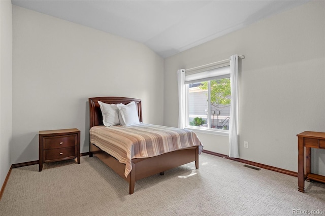 1513 Cannon Mountain Dr, Longmont, CO 80503 - bedroom featuring vaulted ceiling, baseboards, and light carpet