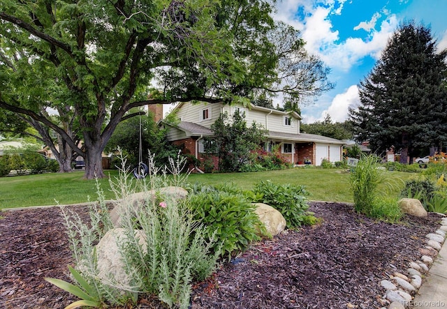 10373 W 75th Ave, Arvada, CO 80005 - traditional home with brick siding, an attached garage, and a front yard