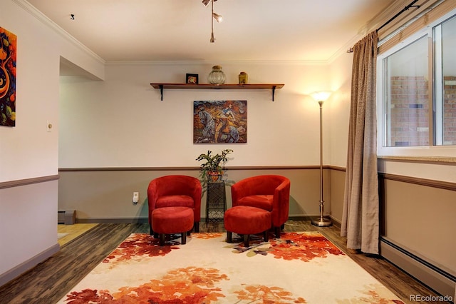 10373 W 75th Ave, Arvada, CO 80005 - living area with a baseboard heating unit, wood finished floors, ornamental molding, and a baseboard radiator