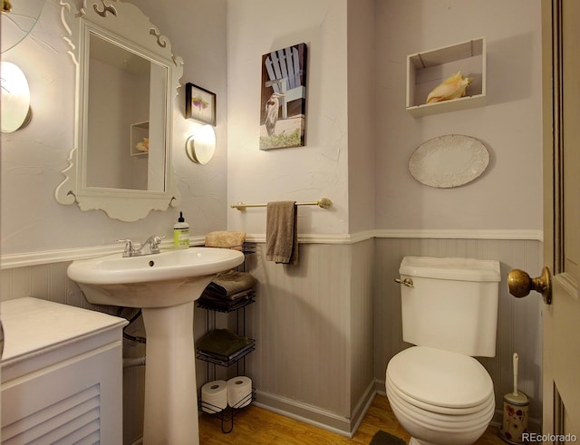 10373 W 75th Ave, Arvada, CO 80005 - half bath featuring wainscoting and wood finished floors