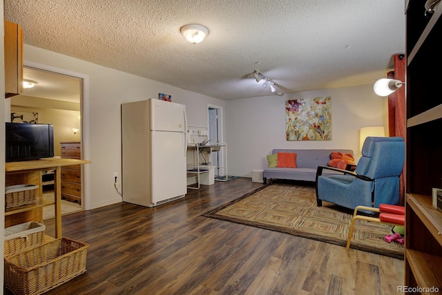 10373 W 75th Ave, Arvada, CO 80005 - living room featuring wood finished floors and a textured ceiling