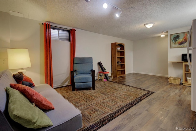 10373 W 75th Ave, Arvada, CO 80005 - living area with wood finished floors and a textured ceiling