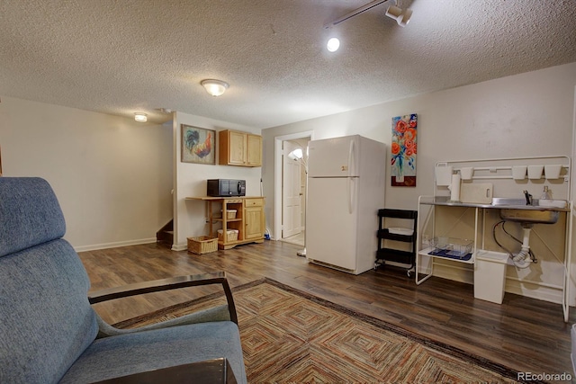 10373 W 75th Ave, Arvada, CO 80005 - living room featuring dark wood finished floors and a textured ceiling