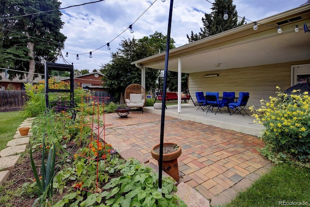 10373 W 75th Ave, Arvada, CO 80005 - view of patio / terrace featuring an outdoor fire pit