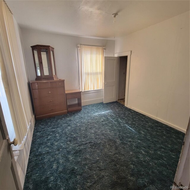 unfurnished bedroom with carpet