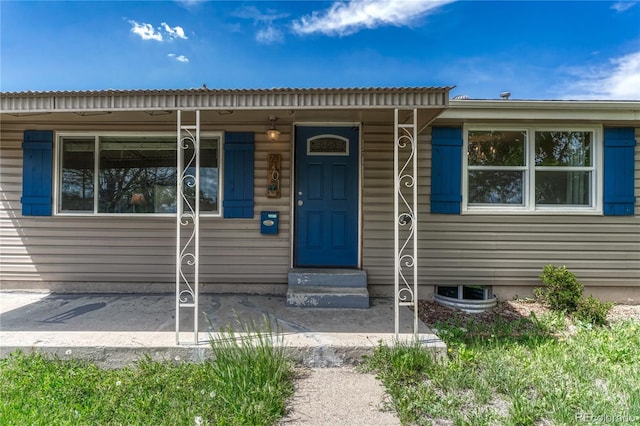 doorway to property featuring covered porch