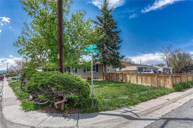 view of home's exterior featuring fence