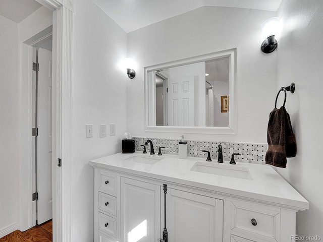 bathroom featuring double vanity and a sink