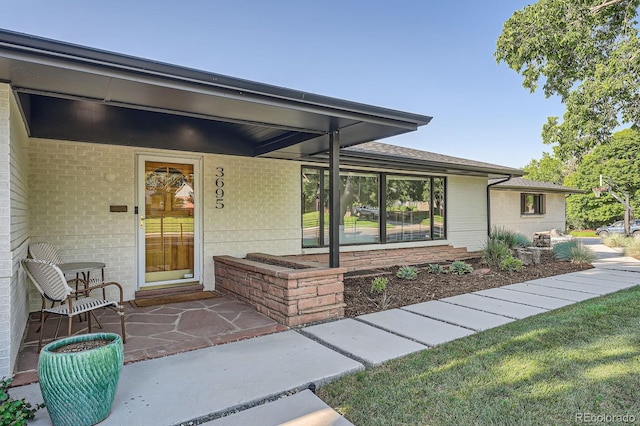 3695 E Dartmouth Ave, Denver, CO 80210 - view of exterior entry with brick siding